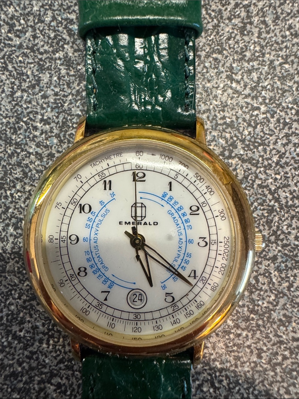 Emerald Gold Case Watch with Green Strap and Blue Dial Accents